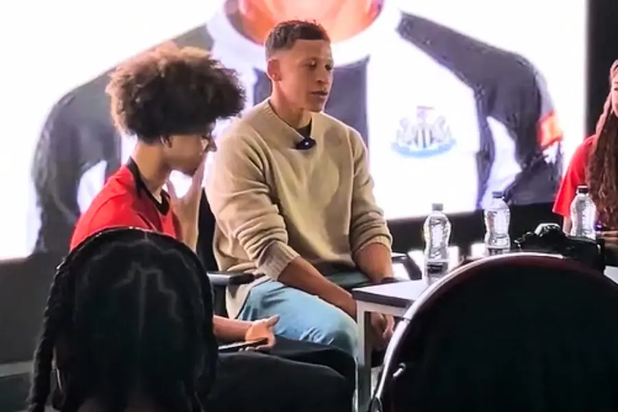 Former professional footballer Dwight Gayle answering CCC student questions